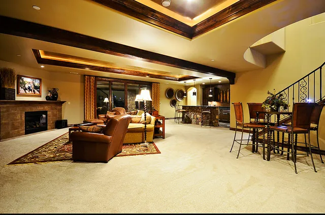 Monitor Rock custom home — Stairway Landing To Living Room To Kitchen Transition