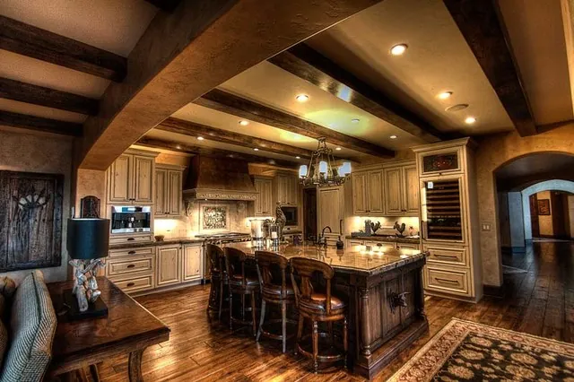 Tuscan Villa custom home — Kitchen Island To Range