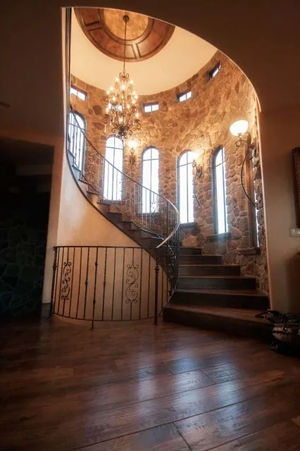 Tuscan Villa custom home — Staircase Portrait Feature