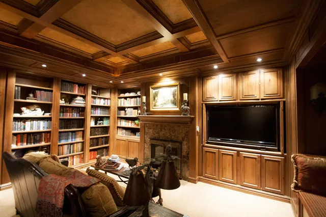 Tuscan Villa custom home — Library Theater Room